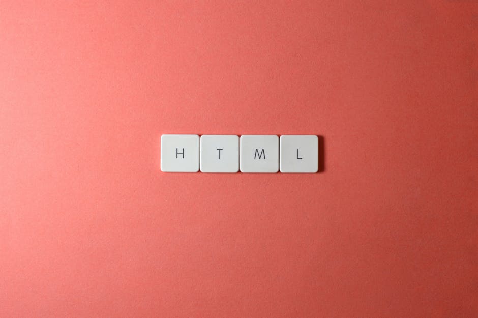 A close-up image showing four white tiles arranged horizontally on a pink background, each tile featuring a black letter spelling out 'HTML'. The surface of the tiles appears smooth and matte, with su